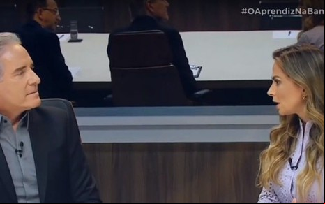 Roberto Justus e Vivianne Brafmann na sala de reuniões que antecedeu demissão em O Aprendiz - REPRODUÇÃO/BAND