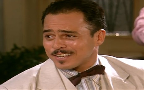 O ator Marcelo Barros sorrindo em cena de Alma Gêmea