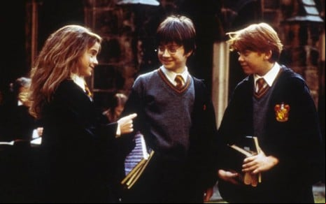 Emma Watson, Daniel Radcliffe e Rupert Grint em cena de Harry Potter e a Pedra Filosofal